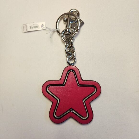 NWT Coach CP899 Spinning Star Bag Charm In Signature Canvas Bright Violet - Picture 2 of 2
